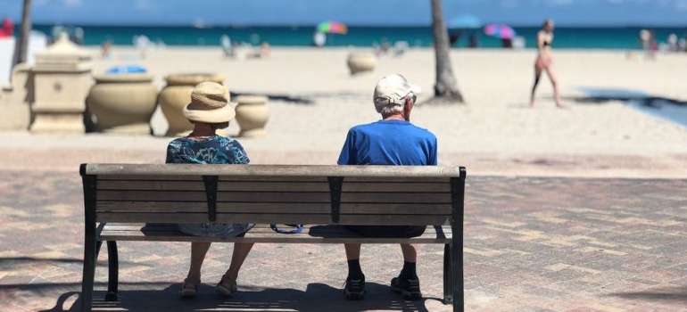 a couple sitting on a bench