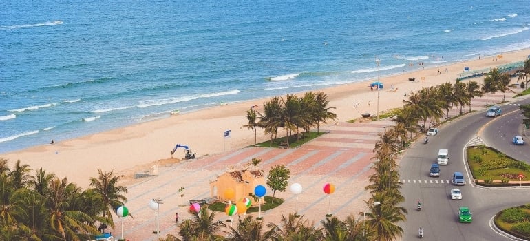 a beach beside a road