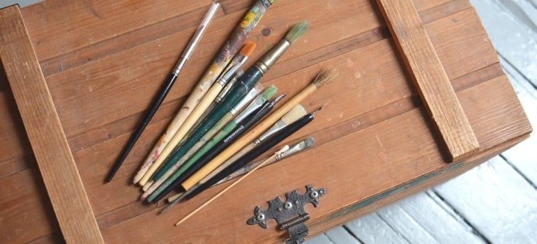 Paintbrushes and an old crate