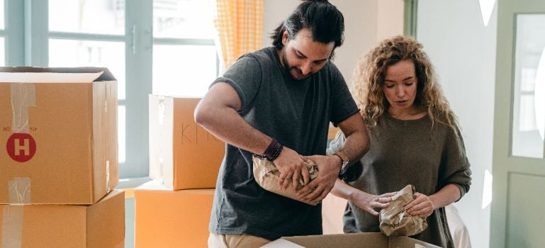 a couple packing for their move to Marathon