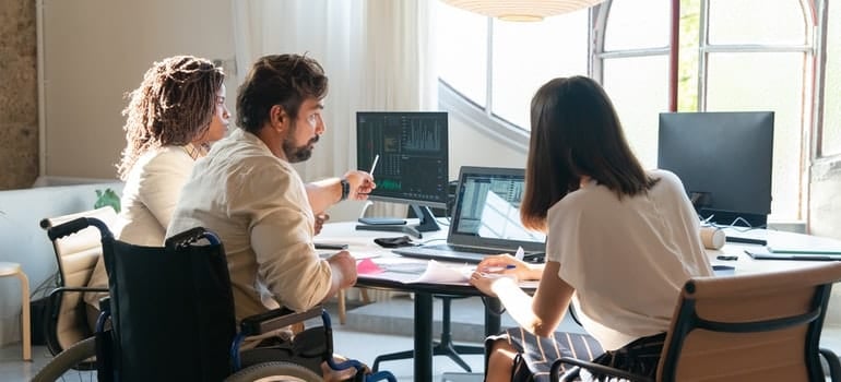 people sitting and doing research on affordable real estate markets in Miami