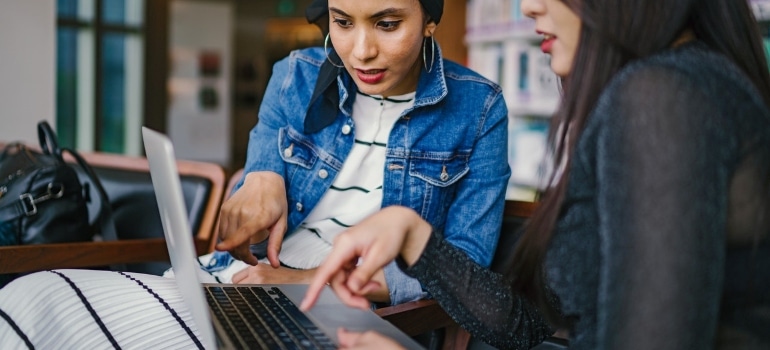 two women with a laptop