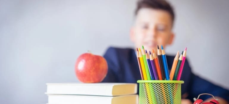 a boy sitting at school