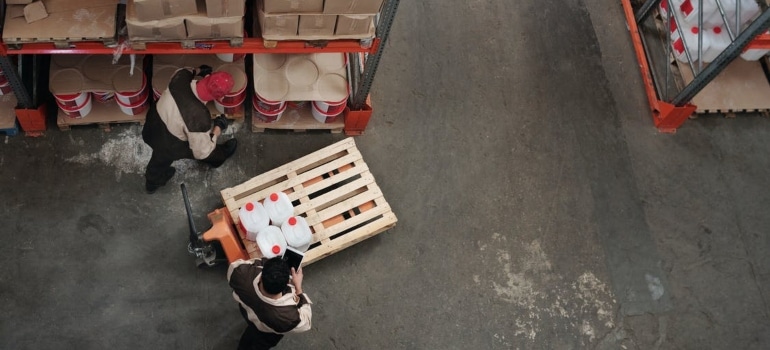 Two man in a storage unit. Long-term storage rental in Coconut Grove is a safe place for your things.