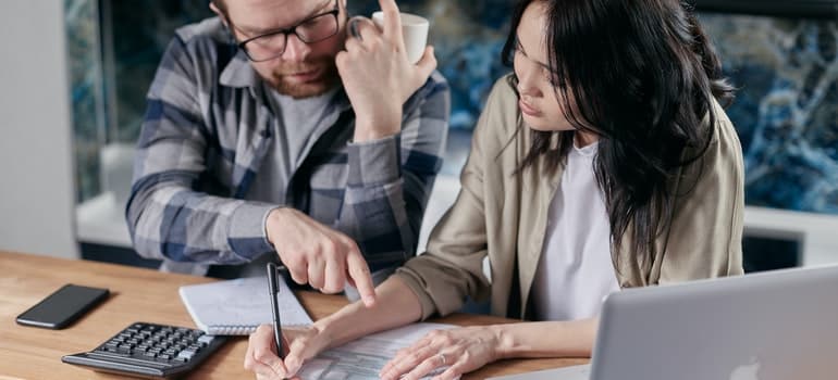 two people discussing about mistakes people make when choosing movers