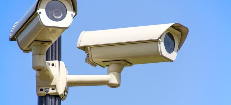 White security camera under the blue sky