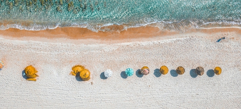 Aerial View Photography of Umbrellas on Shore