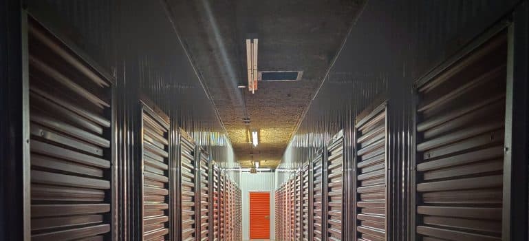 A long hallway with storage units