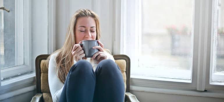 A woman drinking tea and relaxing