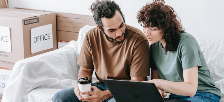 A couple searching the net for the place to get durable moving supplies 