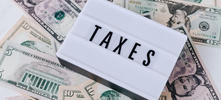 a tax sign and money