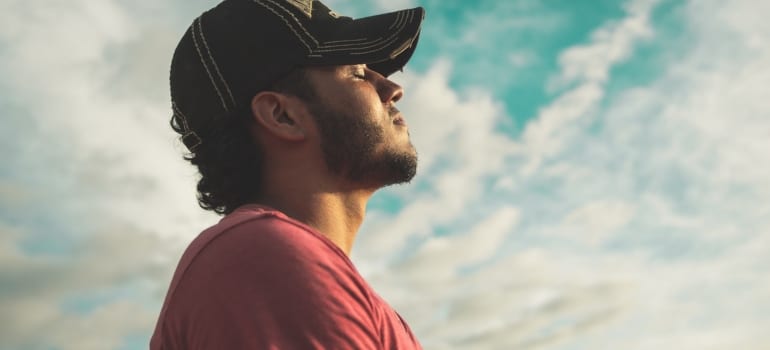 Man enjoying his peace of mind after he managed to find skilled antique movers in Coral Gables