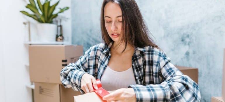 a woman packing for moving