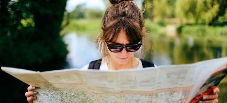 A woman reading the map of Florida