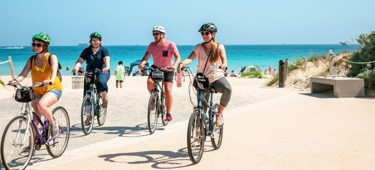 A family cycling the beach