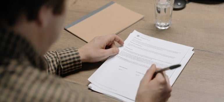 a man signing papers