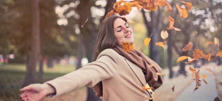 A woman in the park during fall 