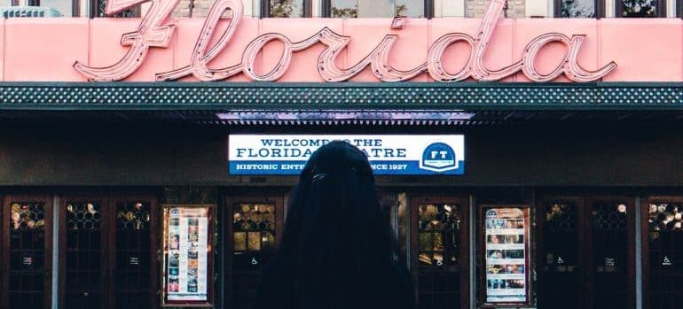 woman looking at the Florida theater