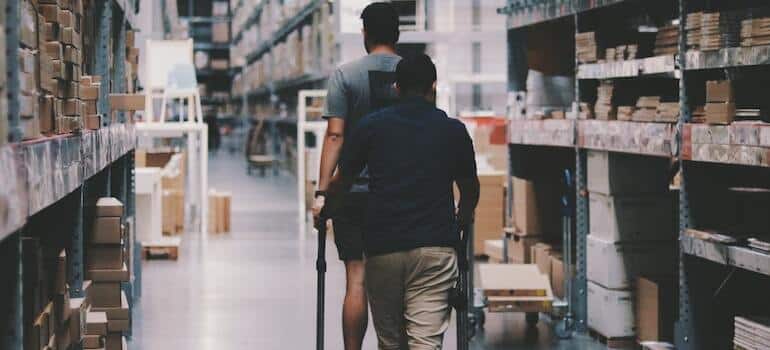 A man puttign items inside a warehouse