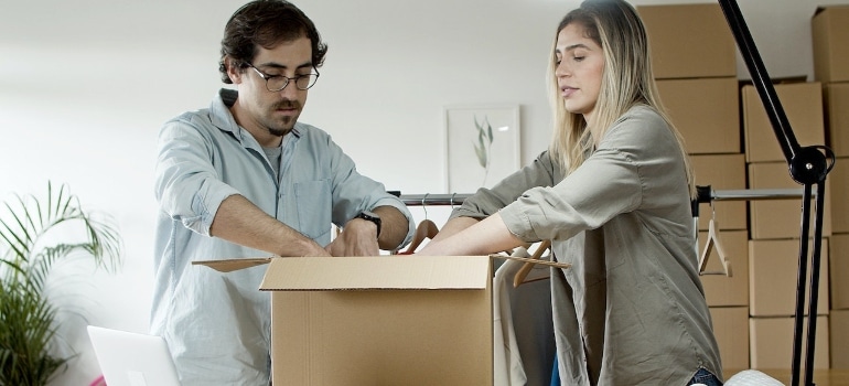 Couple Packing Products Together. 