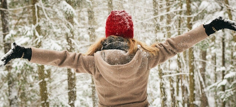 Woman in the snow after Moving from Miami to a different climate