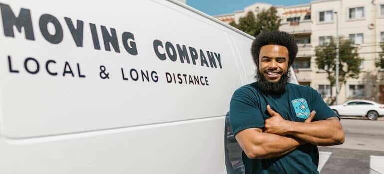 A mover in front of his van