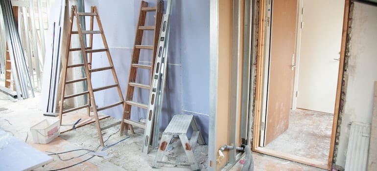 A house undergoing major renovations, with ladders on the walls and etc, something a lot of people do in Fort Lauderdale, instead of choosing to move.