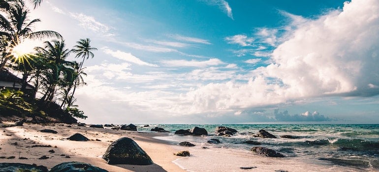 A picture of a sandy beach with a beautiful sky above it.