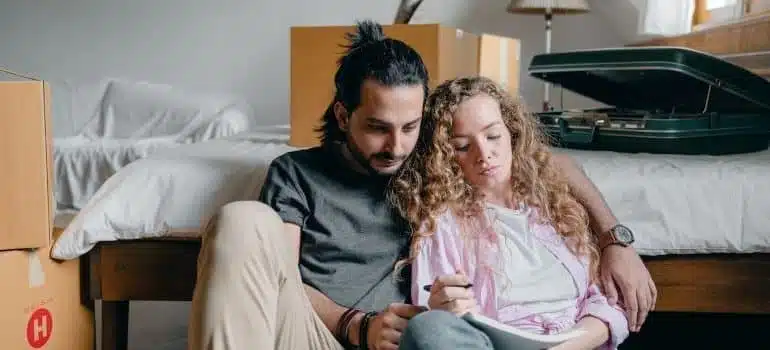 a couple assembling a moving plan