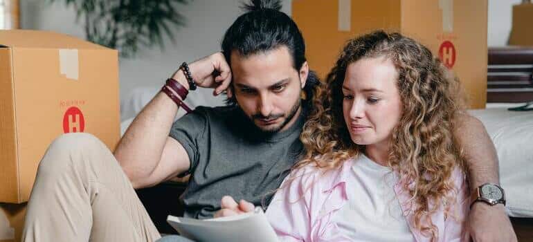 thoughtful couple writing something