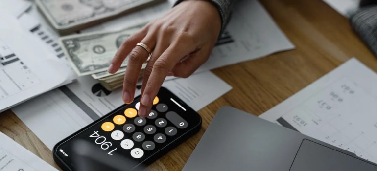 a woman calculating on her phone