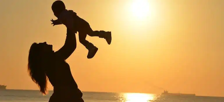 A woman and a child at sunset
