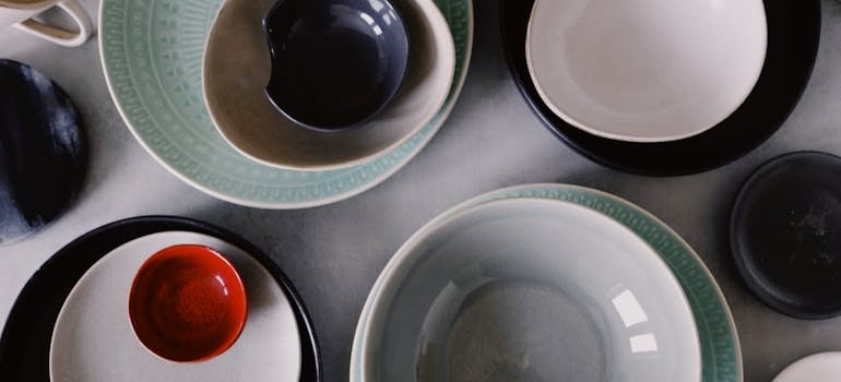 Stacks of bowls before owners pack and unpack porcelain