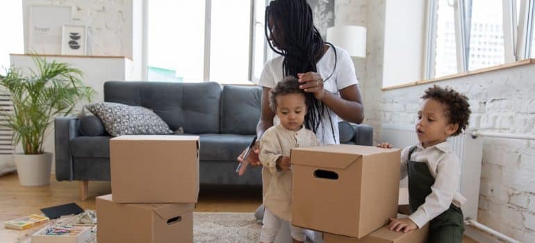 A family packing to move to some of the best Miami neighborhoods for families with kids