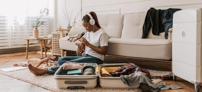 A girl packing a suitcase