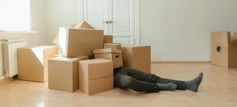 a man lying on the floor and thinking how to prepare for moving to South Beach alone