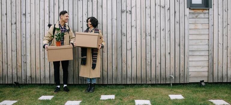 couple is standing with boxes