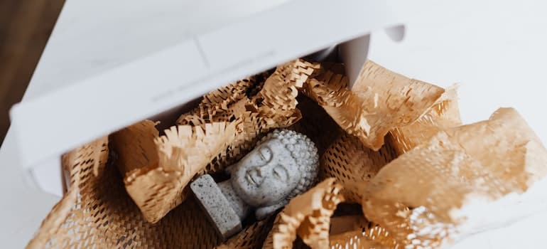 An antique statue of Buddha, an example of what kind of items you'd have if you want to store antiques in Coral Springs.