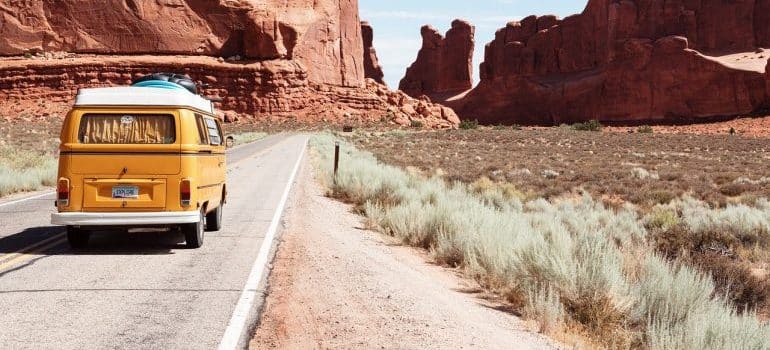 a van traveling down the road