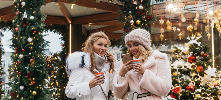 Two women are enjoying the holidays.