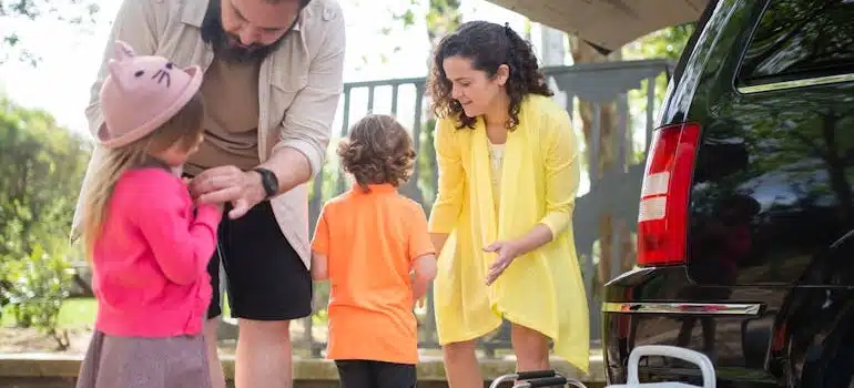 A family with kids shows how to pack your car when moving