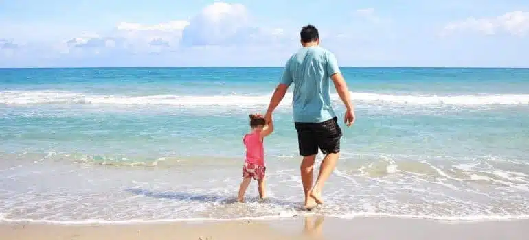 A father and a daughter on a beach