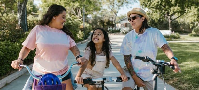 Three girls riding bikes