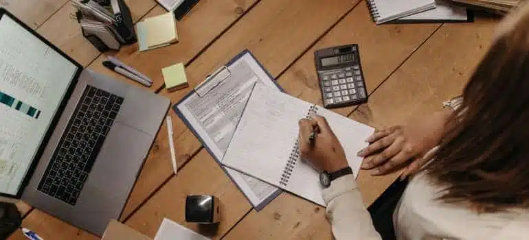 Woman writting notes in the notebook