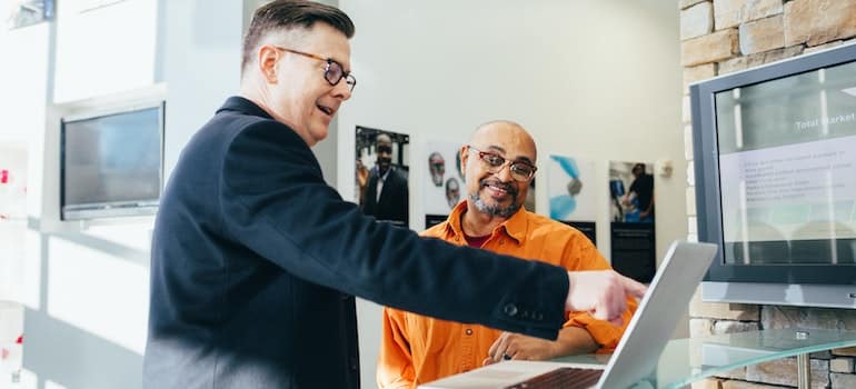 Two colleagues that work at a small business talk about potential storage services.