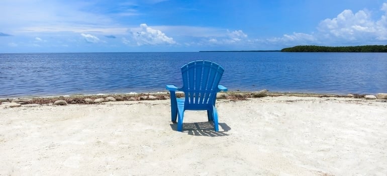 A blue chair on the beach