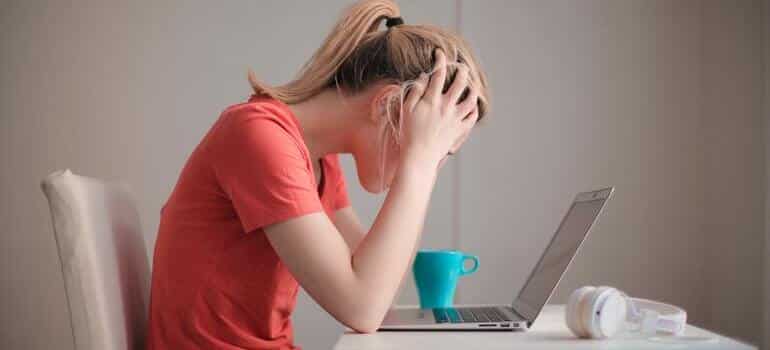 woman wondering should she v-hire movers when moving out of state for college