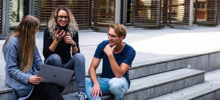 three young people talking 