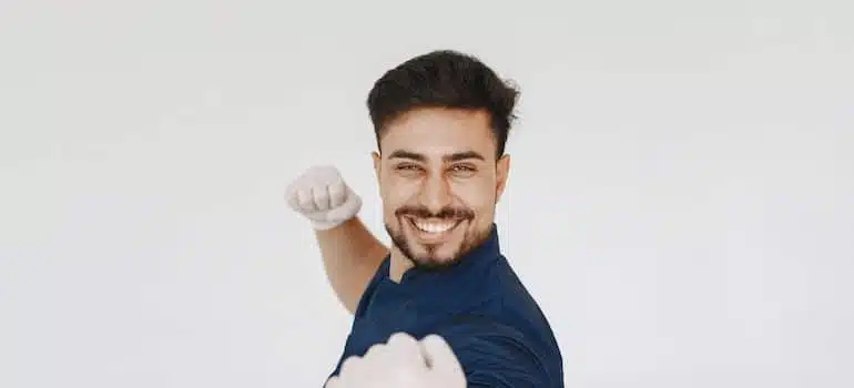 Smiling man in white gloves