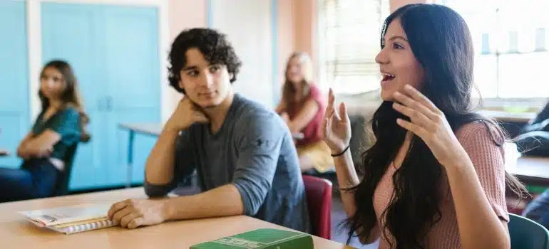 female student participating in class